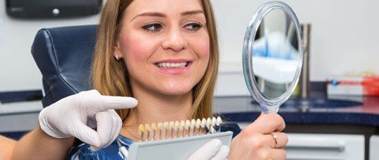 Patient smiling after dental implant procedure