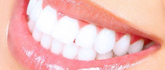 Patient smiling after a professional teeth whitening treatment